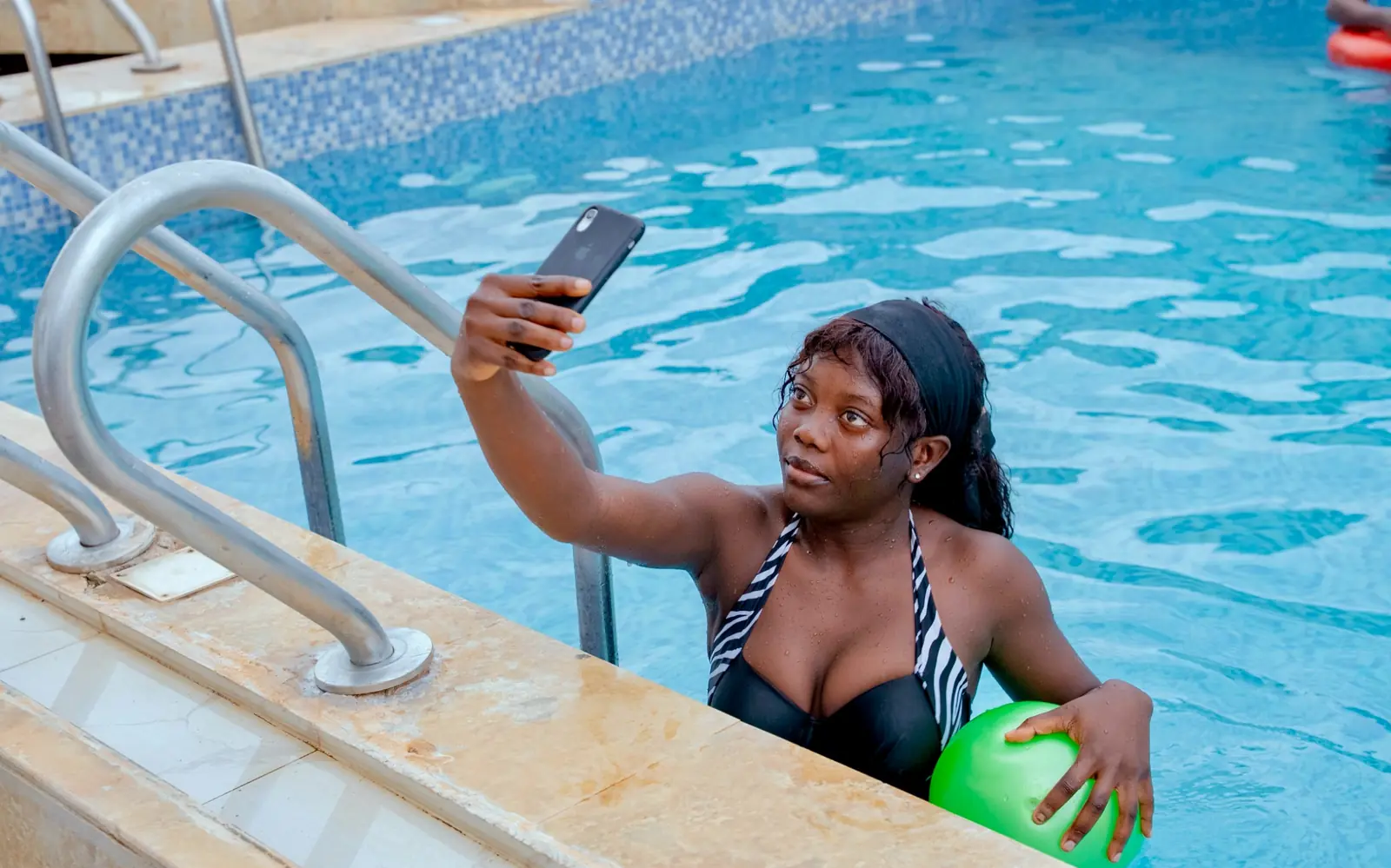 Guest capturing a poolside moment at Diplomat Enclave Suites in Abuja