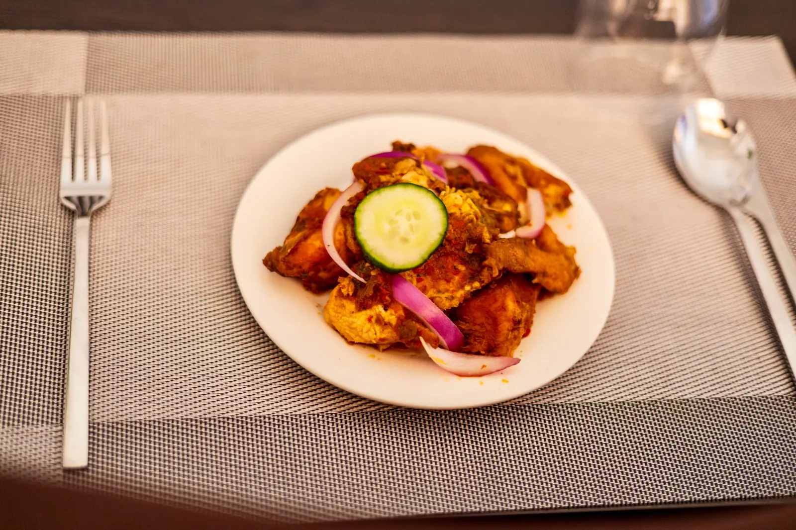 Grilled chicken meal served at Diplomat Enclave Suites restaurant